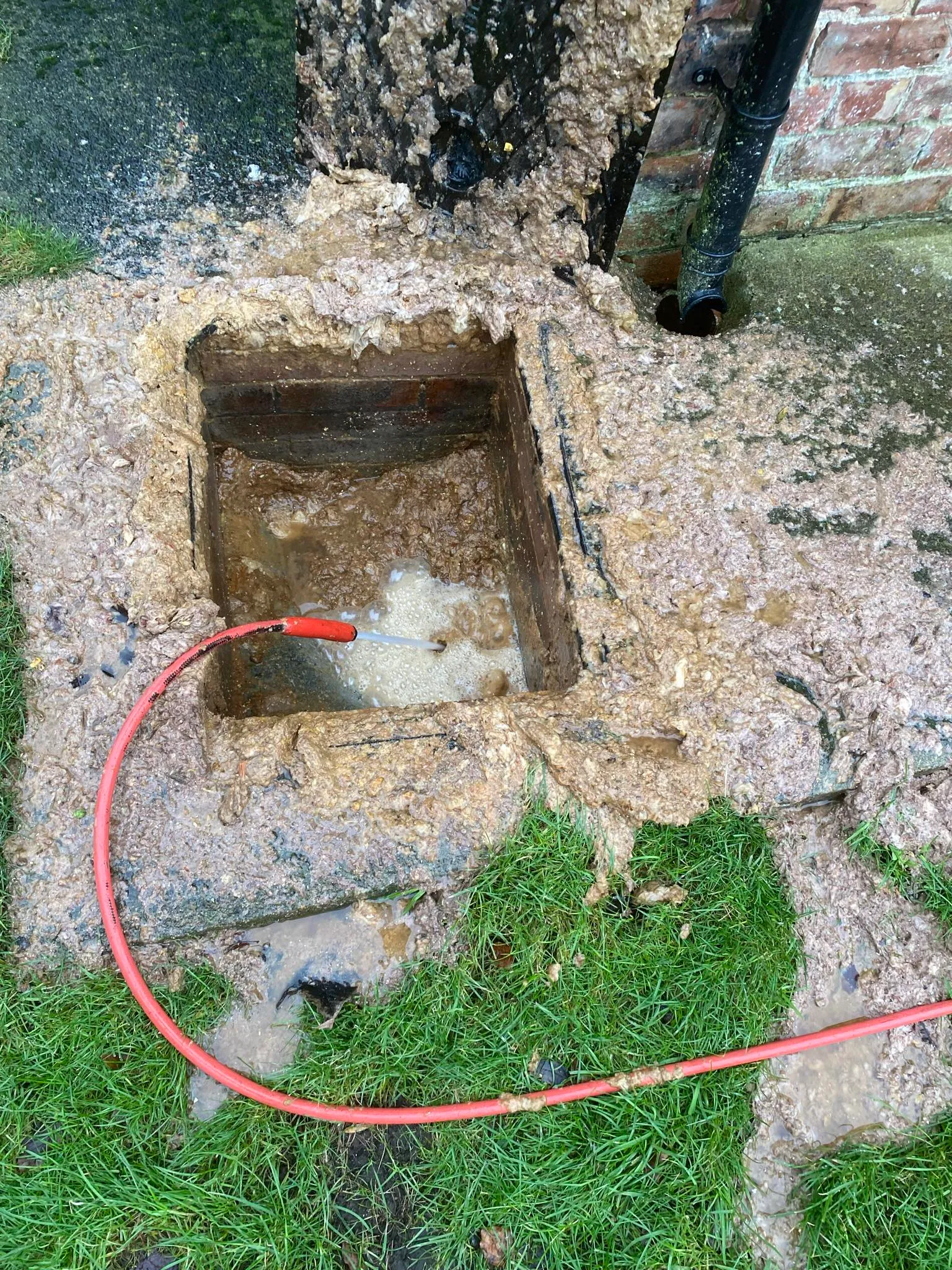 Image showing a heavily blocked outdoor drain being cleared by drain jetting in North Yorkshire.