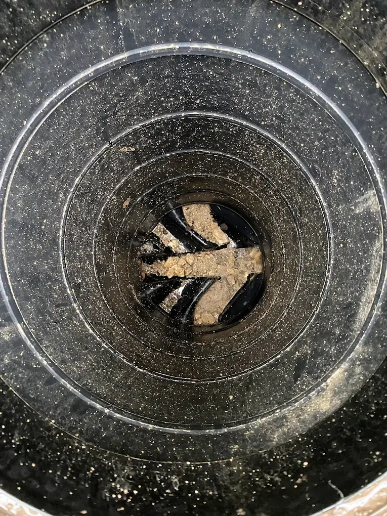 Inside a drain pipe showing debris